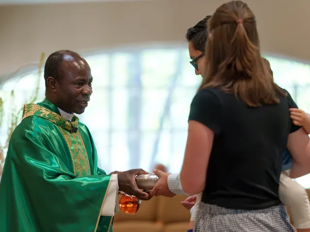 A child receiving a blessing at Communion